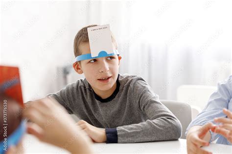 card on forehead guessing game.